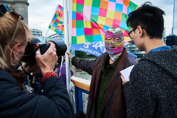 London, United Kingdom - October, 2019: Chinese dissident artist Badiucao giving an interview during a rally in support of Hong Kong's protests © Howard Cheng / Shutterstock London, United Kingdom - October, 2019: Chinese dissident artist Badiucao giving an interview during a rally in support of Hong Kong's protests © Howard Cheng / Shutterstock