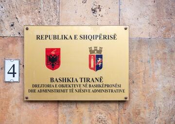 Sign of the Ministry of Justice and the Governmental administrative center in Tirana, Albania. Credits: Werner Lerooy, Shutterstock.