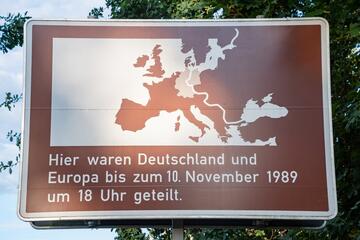 Potsdam, Germany, traffic sign informing about former Iron Curtain next to the Glienicke Bridge, aka the Bridge of Spies © Petr F. Marek/Shutterstock